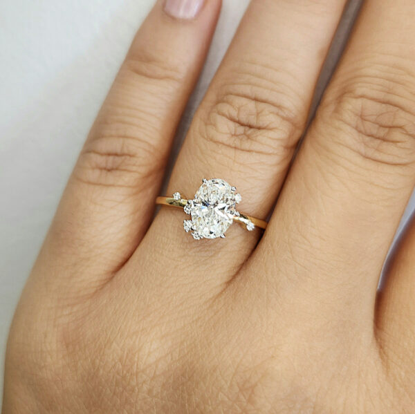 Celestial inspired diamond engagement ring on hand model